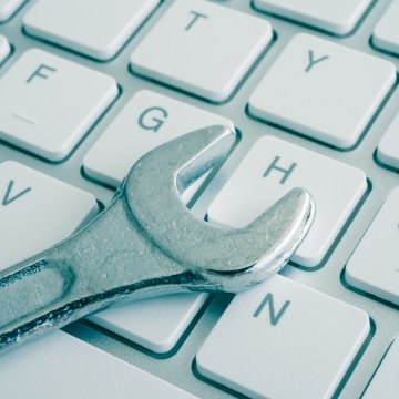 system optimizer software white computer keyboard with wrench on top